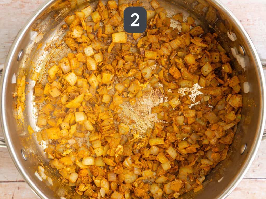 Vegan curry pasta step 2 - add the spices.