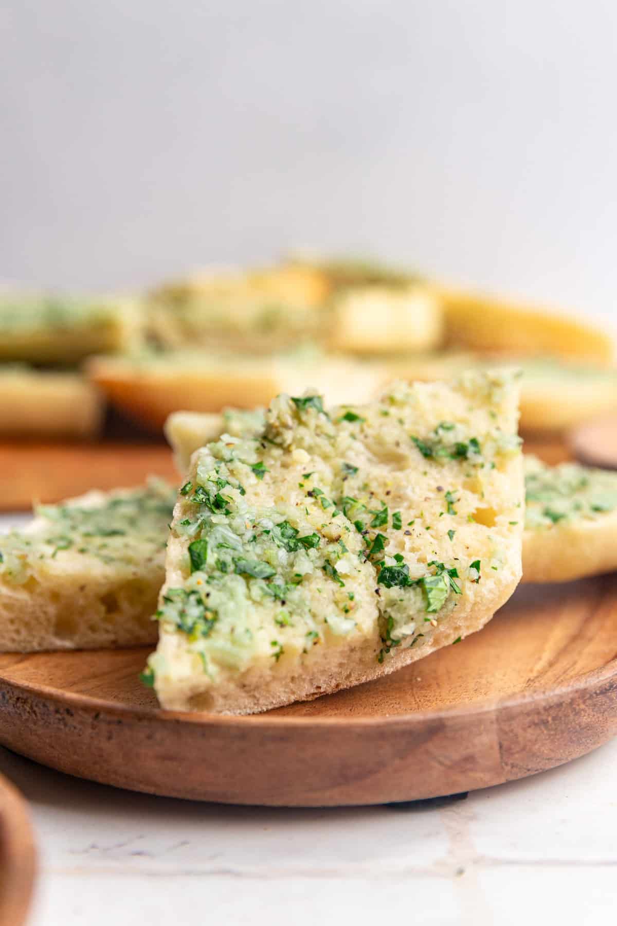 A plate with two slices of garlic bread.