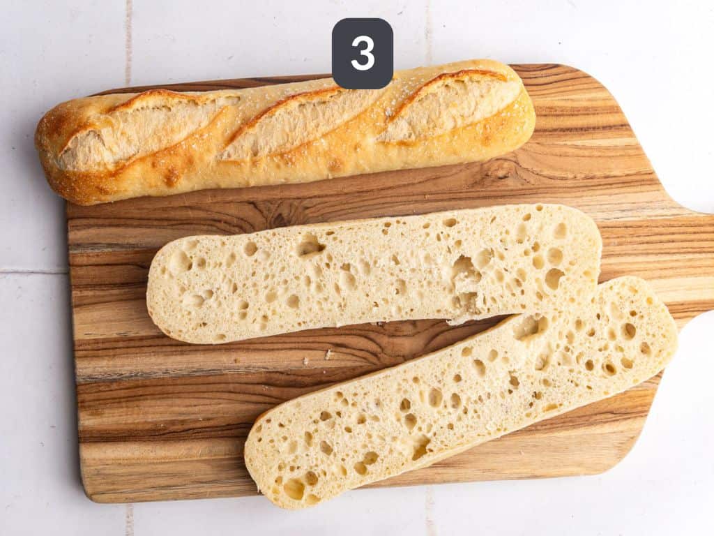 Vegan Garlic Bread Step 3 - slice the baguette in half
