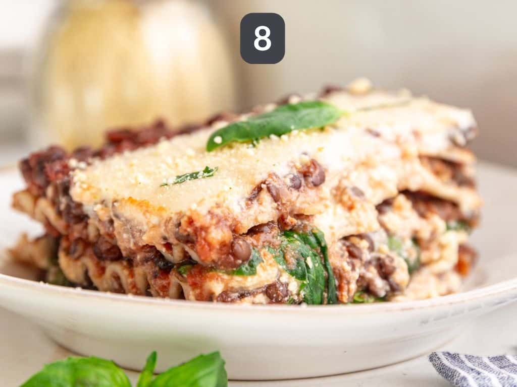 Vegan gluten free lasagna step 8 - serve with vegan parmesan and basil.