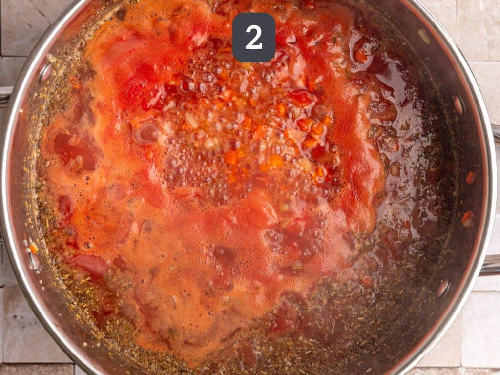 Vegan Pasta e Fagioli Step 2 - add the tomatoes and broth and boil.