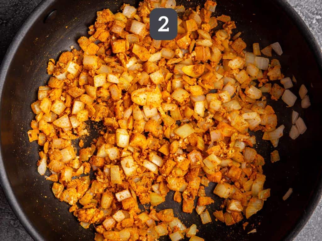 Butter bean curry step 2 - add the spices.