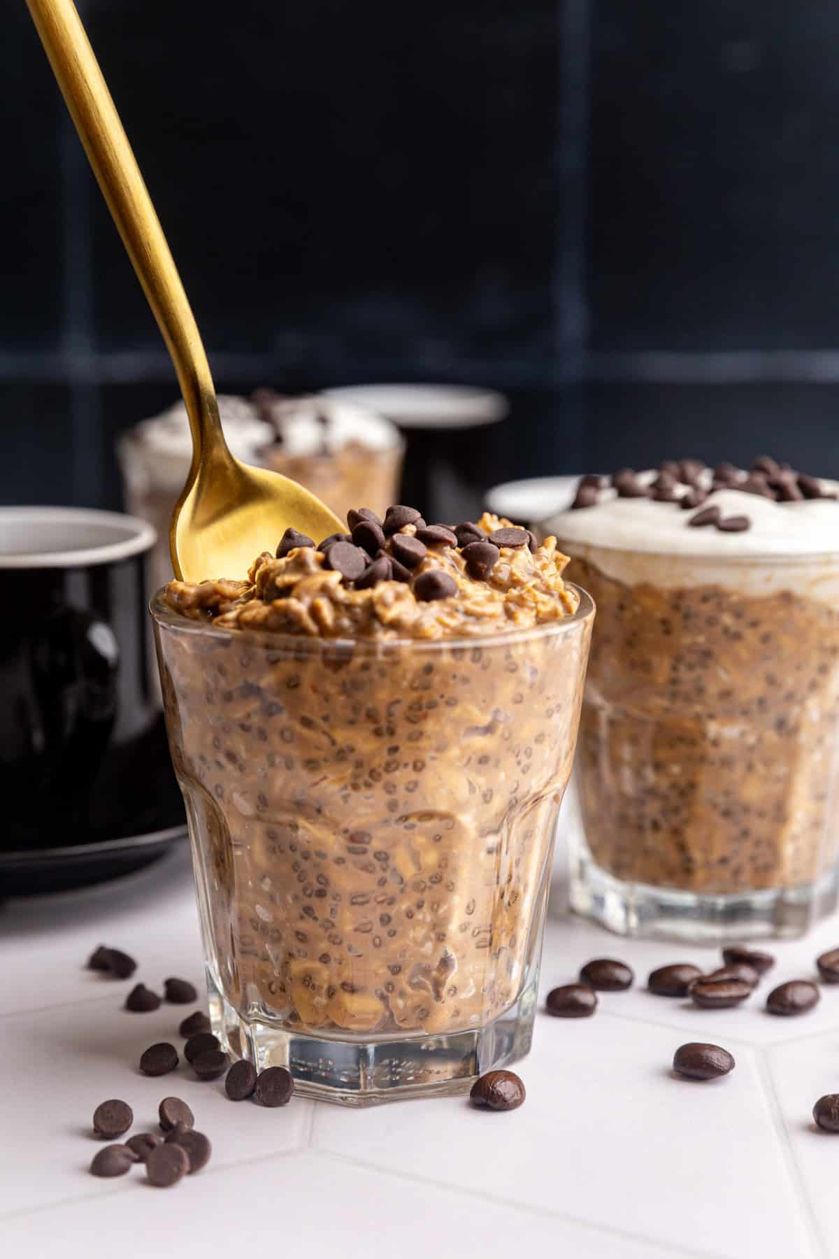 A spoon scooping out a bite of coffee overnight oats.