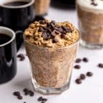 A jar of Coffee Overnight Oats, topped with chocolate chips.