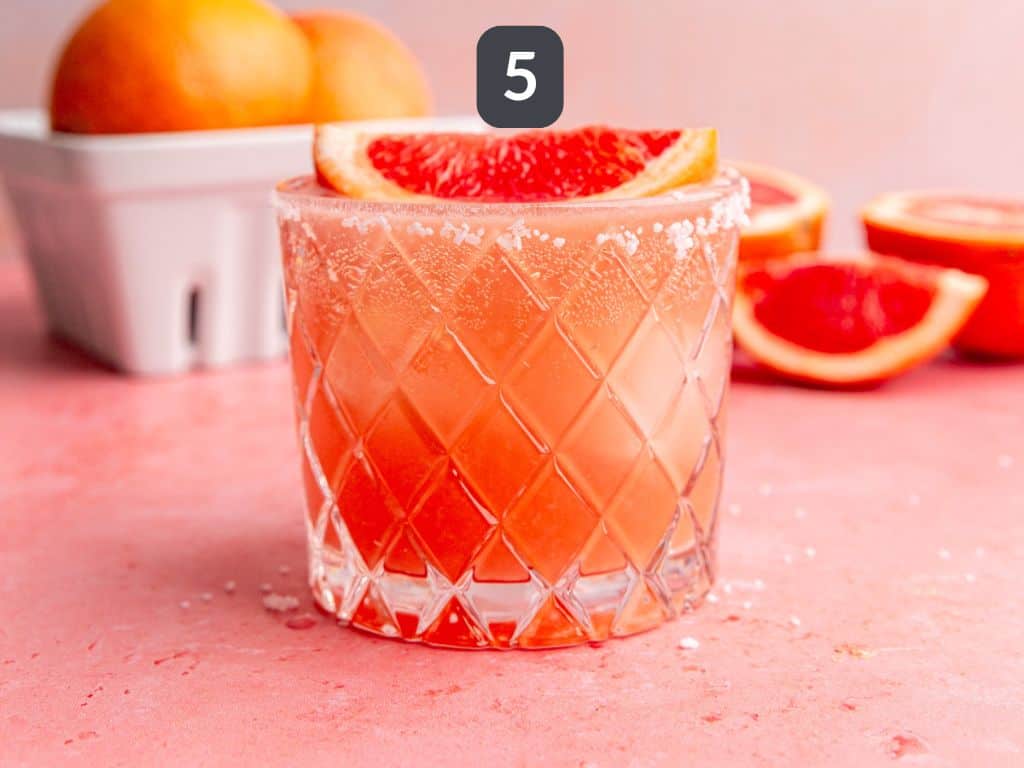 Grapefruit mocktail step 5 - garnish with a grapefruit wedge.