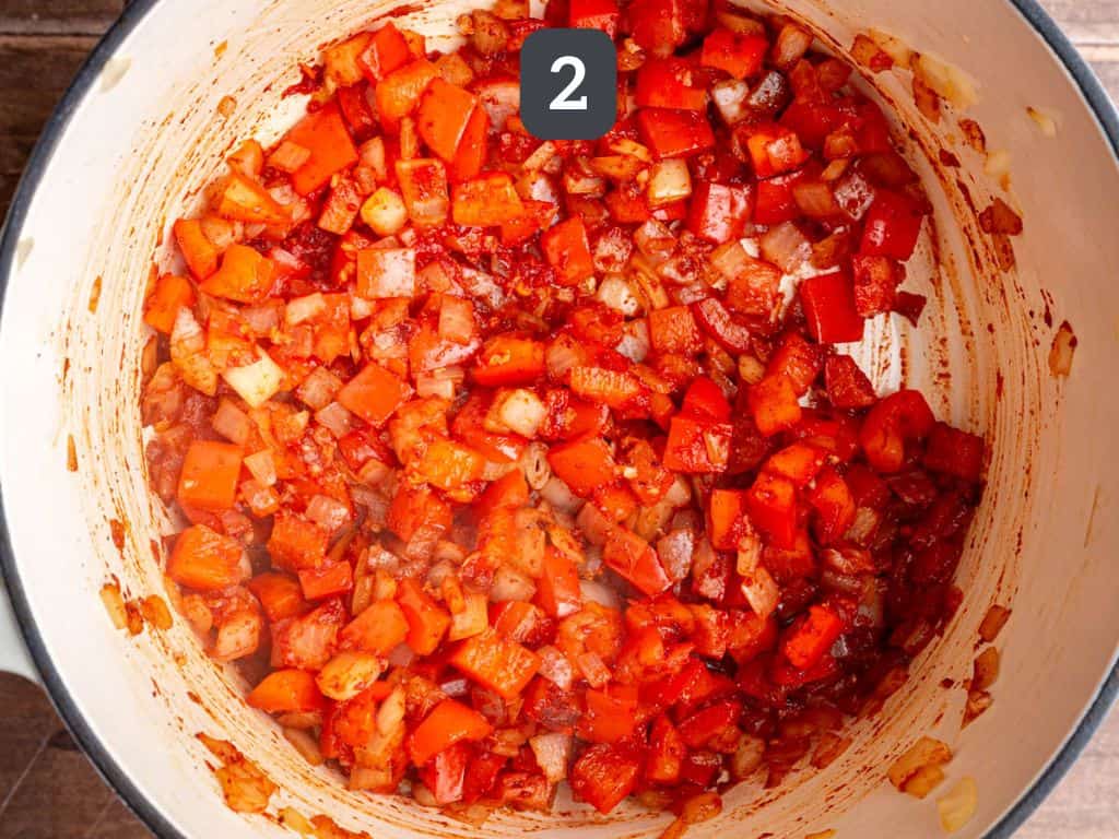 Red Pepper Red Lentil Soup Step 2 - add the garlic, tomato paste, and spices.