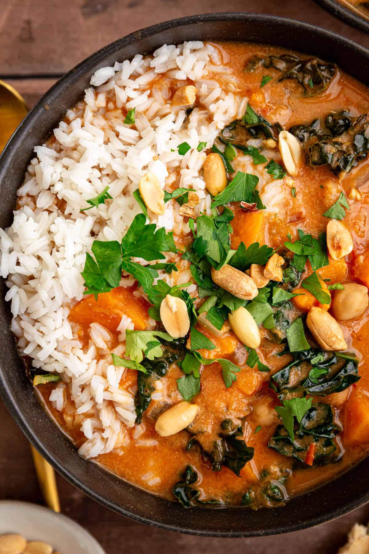 A bowl of Vegan African Peanut Stew, served over rice.