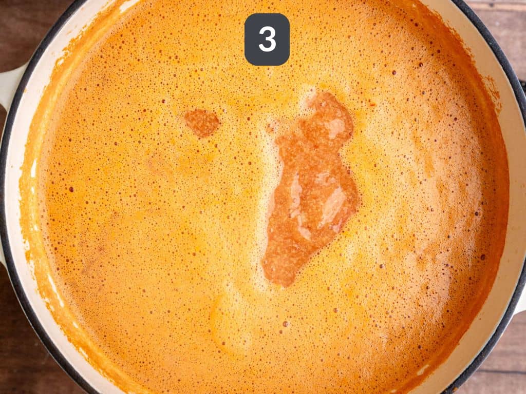 Vegan African Peanut Stew Step 3 - add the sweet potatoes, peanut butter, and tomatoes.