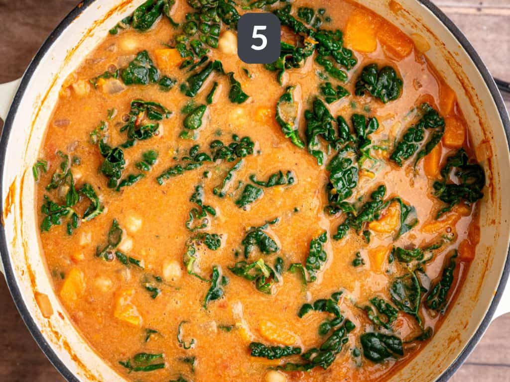 Vegan African Peanut Stew Step 5 - add the kale and chikpeas.