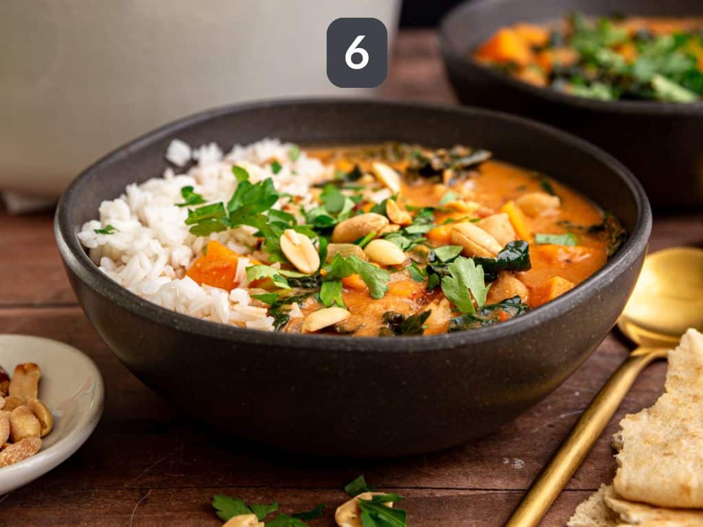 Vegan African Peanut Stew Step 6 - serve with rice, cilantro, peanuts, and pita.