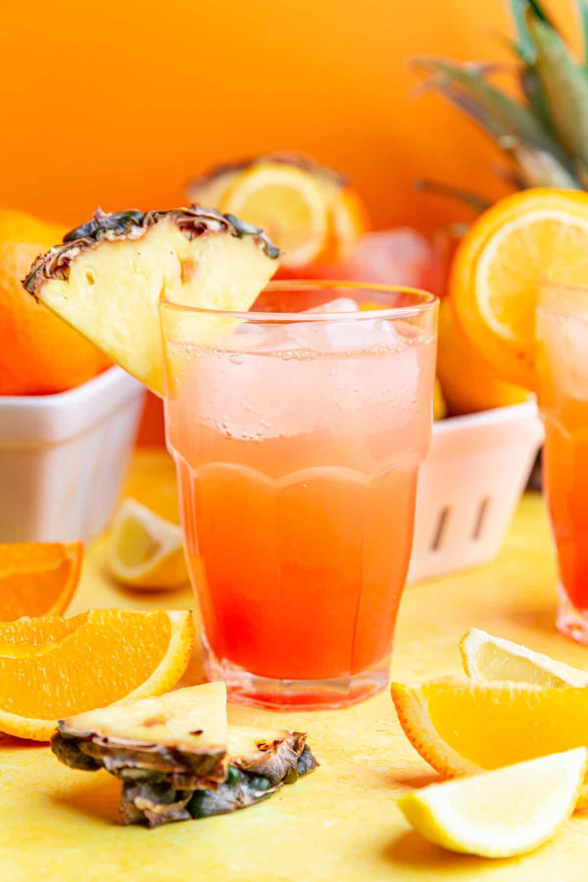 A cinderella mocktail garnished with a pineapple wedge.