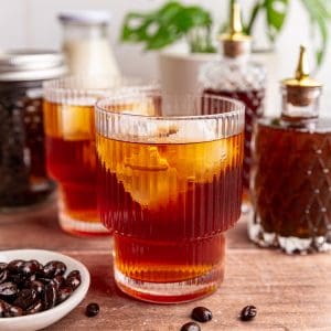 A glass of decaf cold brew, with ice.