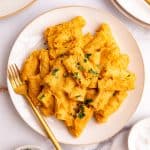 A plate of Creamy Vegetable Pasta Sauce, garnished with parsley.