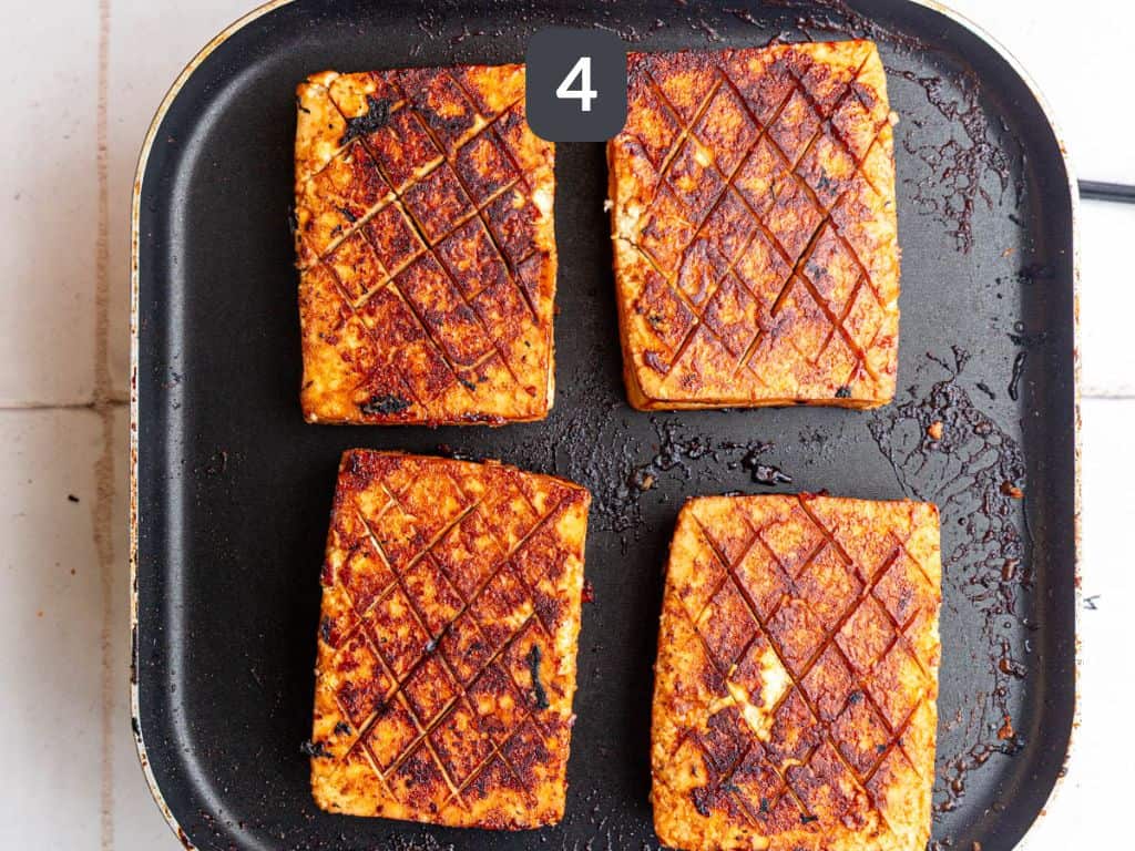 Glazed tofu ham step 4 - continue to cook, adding glaze.