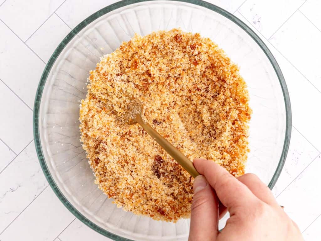 Vegan brown sugar being mixed with a fork.