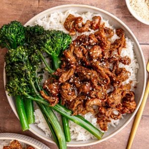 A bowl of vegan chicken teriyaki, garnished with sesame seeds.