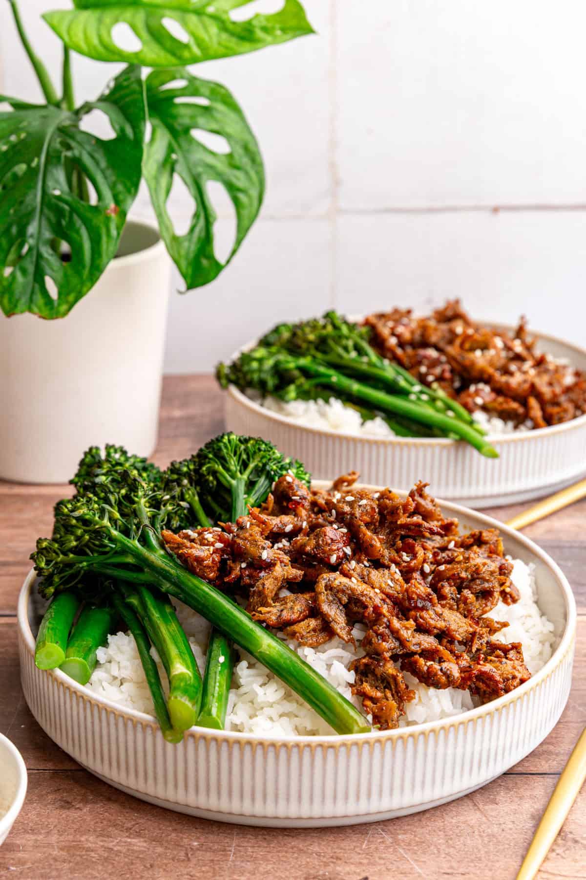Two bowls of vegan chicken teriyaki on a table, ready to serve.