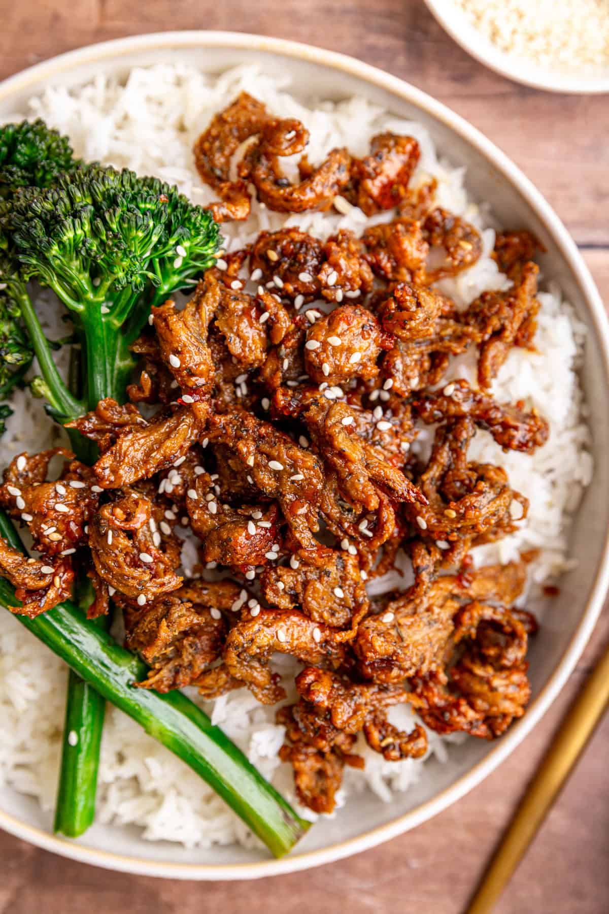 A close up view of the seitan in a bowl of vegan chicken teriyaki.