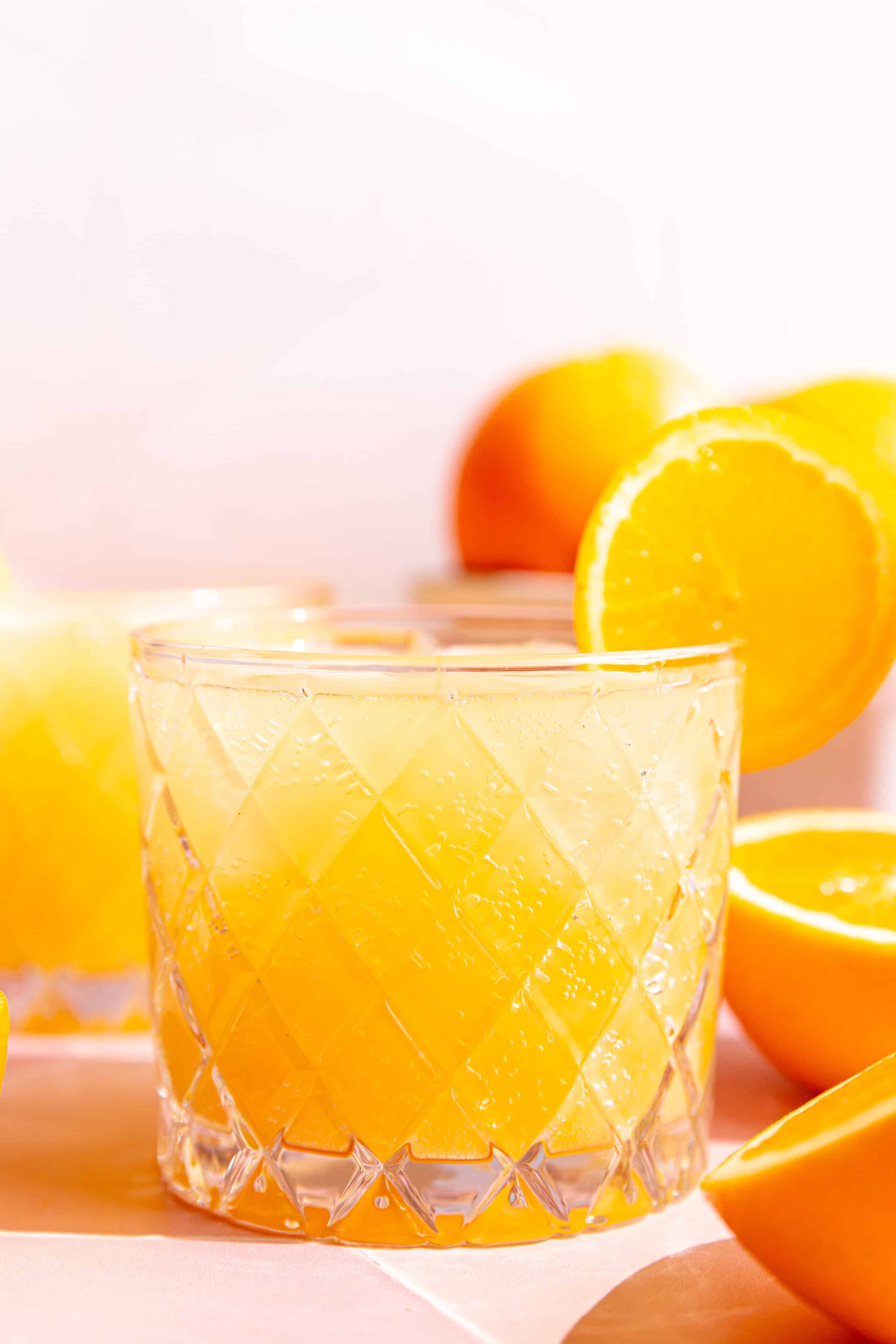 A close up view of the bubbly texture of the aperol spritz.