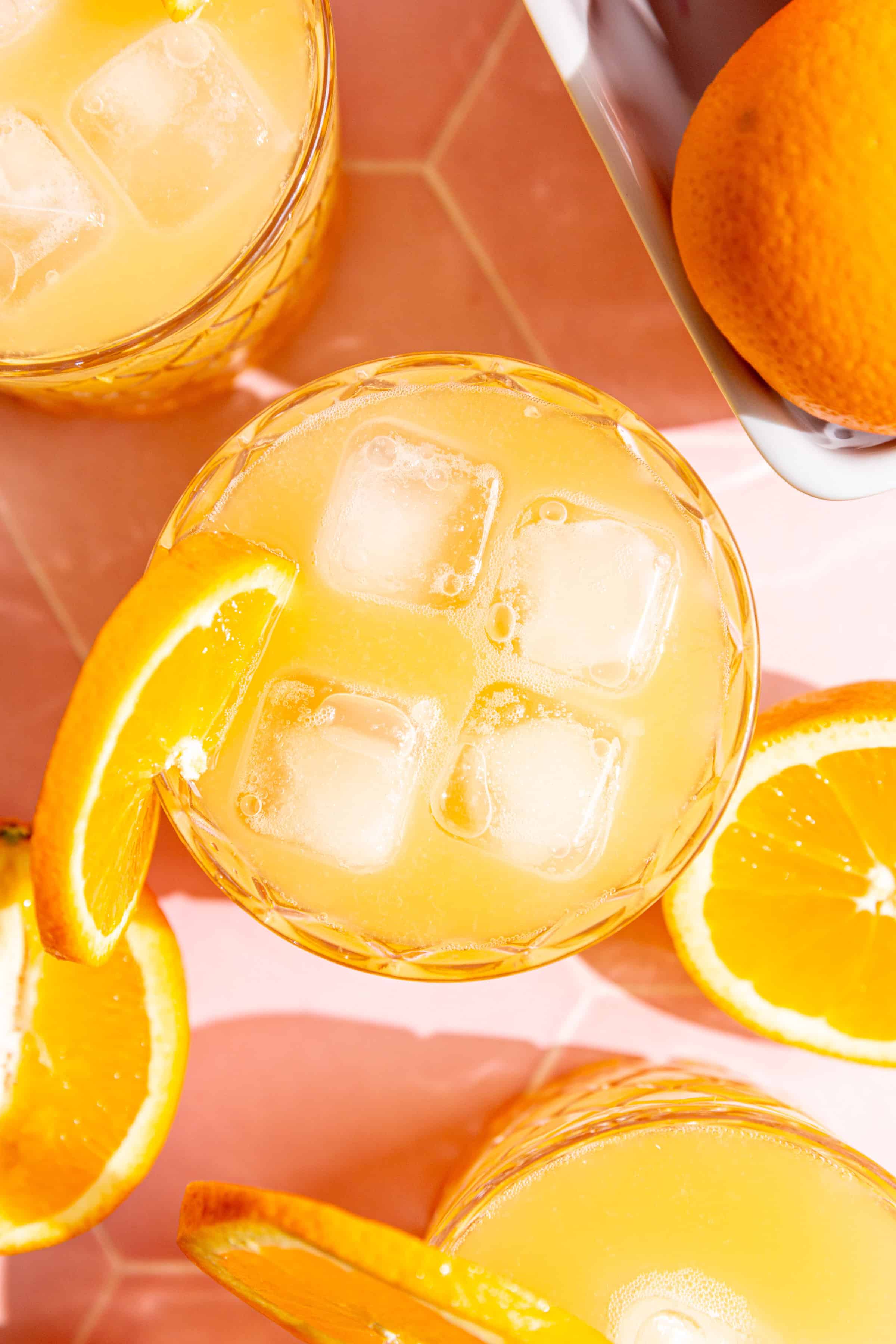 A top-down view of several aperol spritz mocktails.