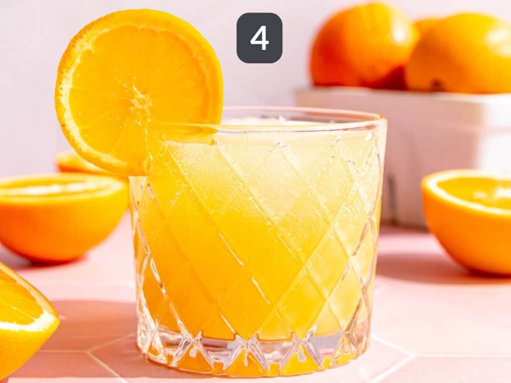 Aperol Spritz Mocktail Step 4 - garnish with an orange slice.