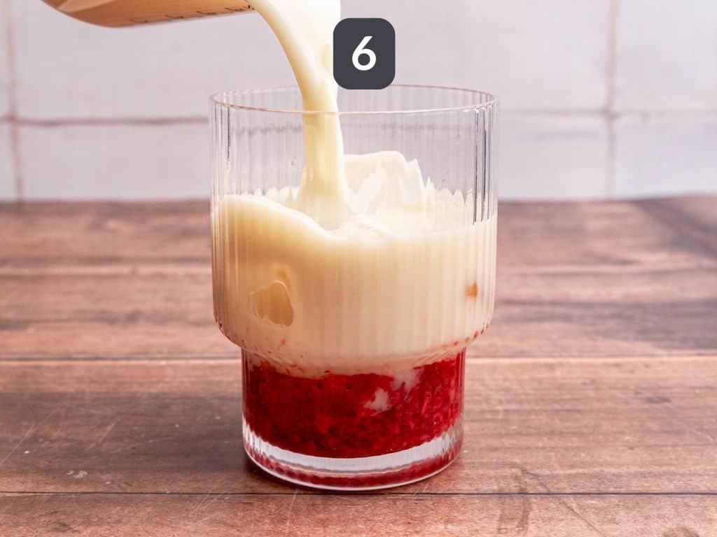 Strawberry Oat Milk Matcha Latte step 6 - pour on the milk.
