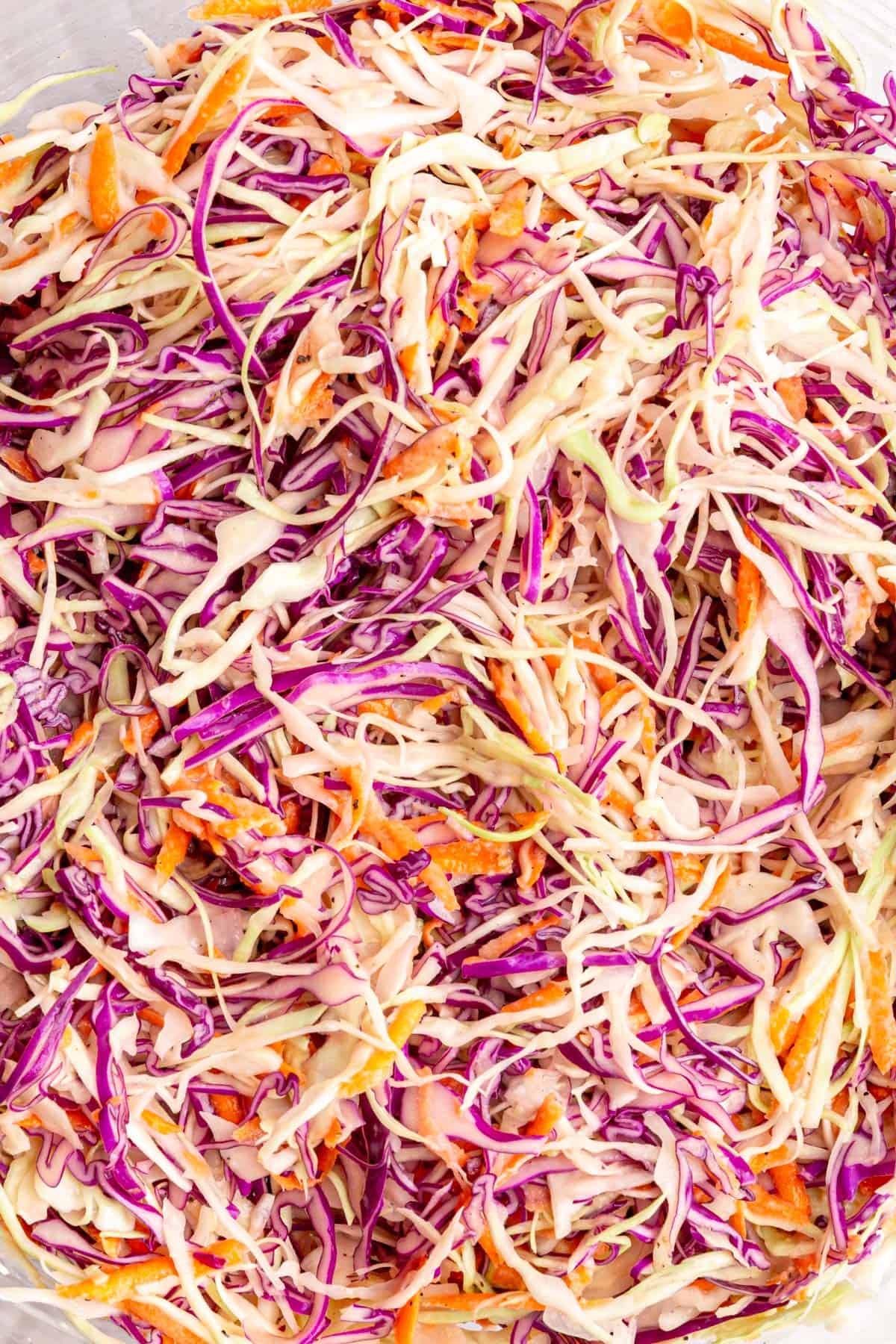 A close up of the texture of the oil free coleslaw.