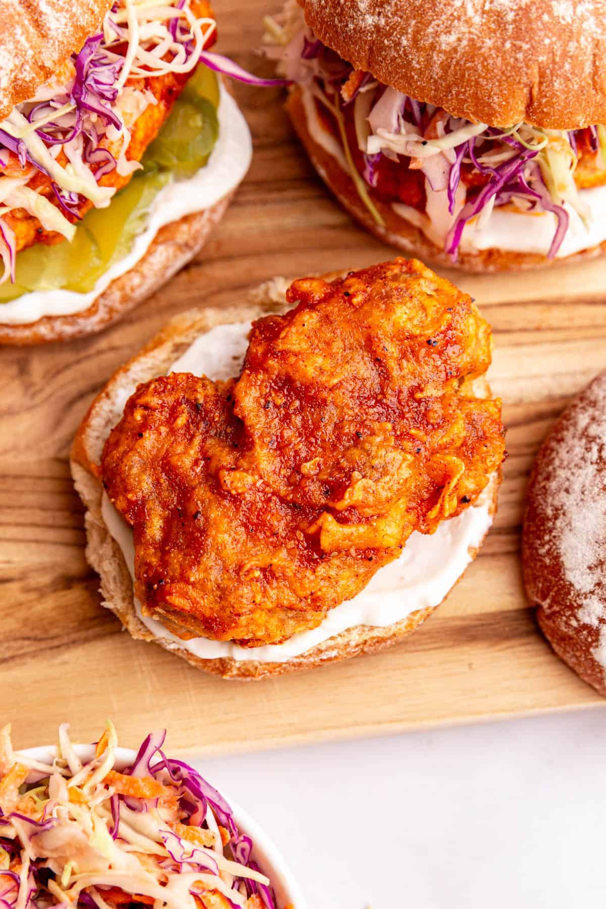 A top down view of a vegan hot chicken piece on a bun.
