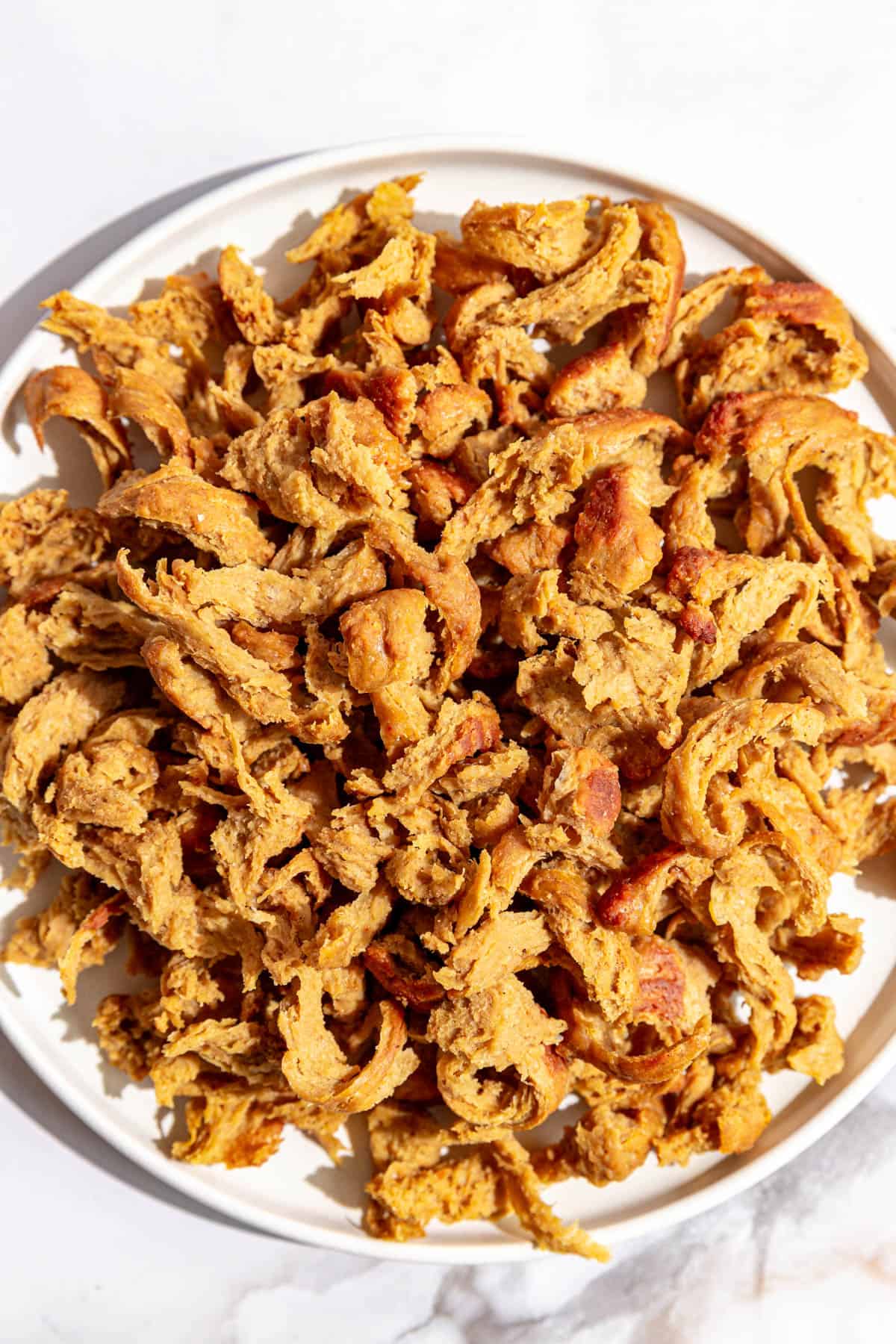 A plate of vegan shredded chicken.