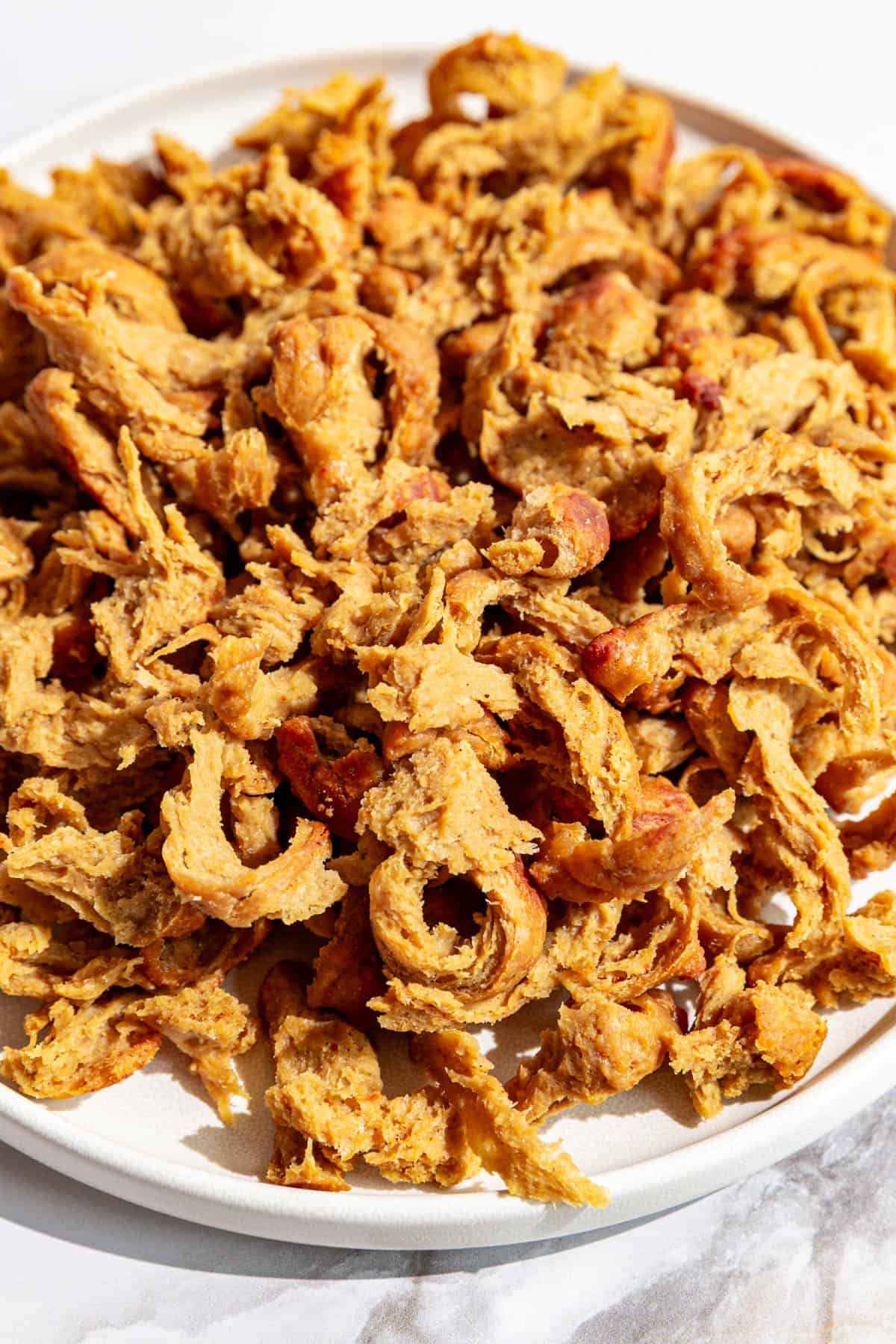 A plate of vegan shredded chicken.