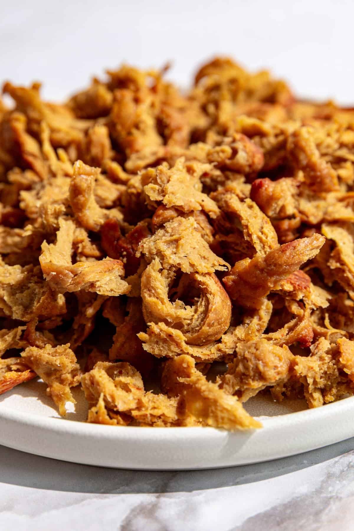 A plate of vegan shredded chicken.