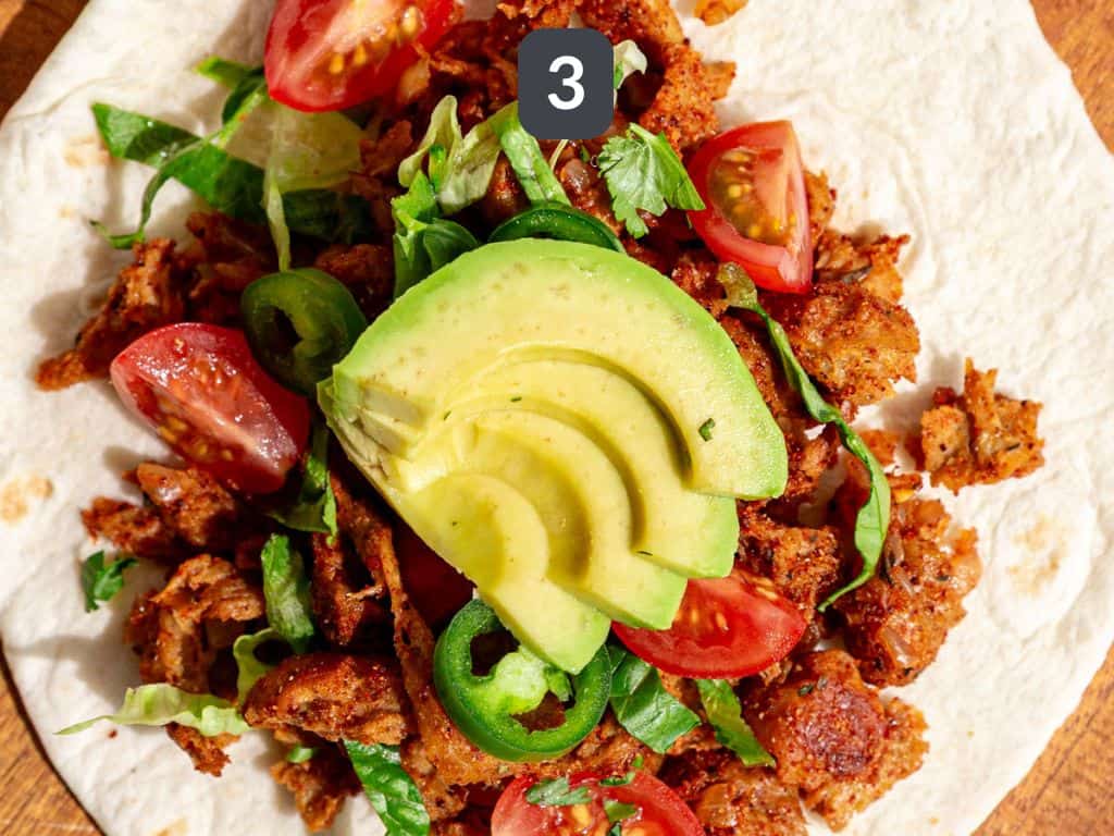 Vegan shredded chicken tacos step 3 - serve with your favorite toppings.