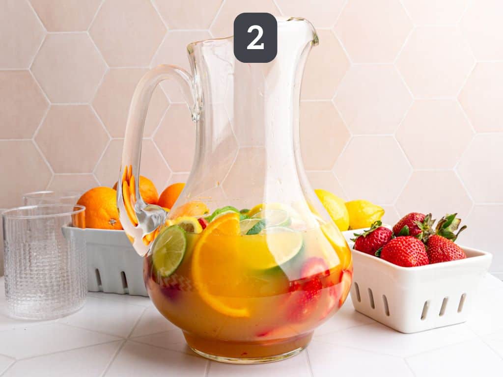 White Sangria Mocktail step 2 - pour in the juices.