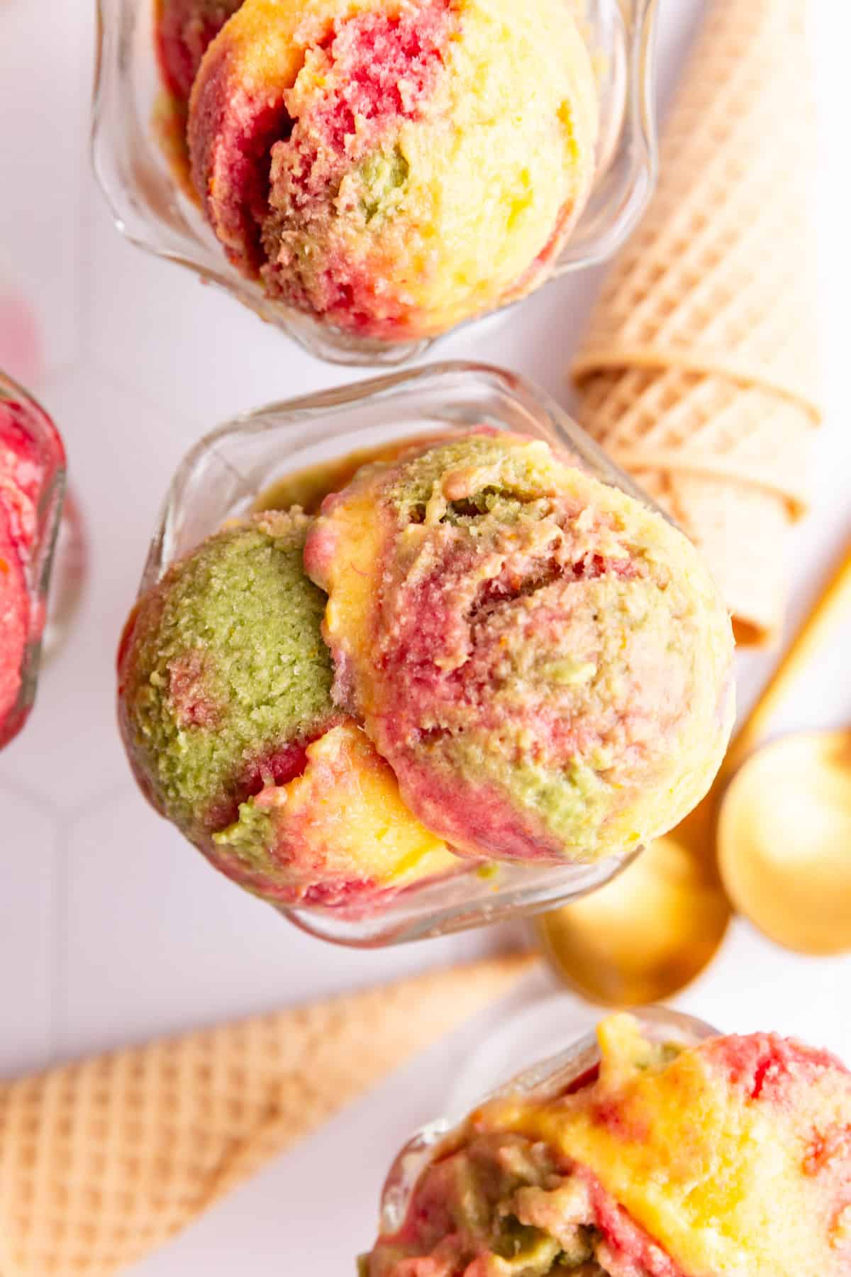 Several glasses of no churn dairy free orange sherbet.