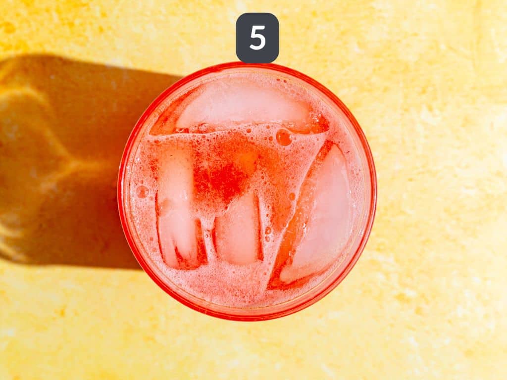 Strawberry Pink Lemonade Mocktail step 5 - top with seltzer water.