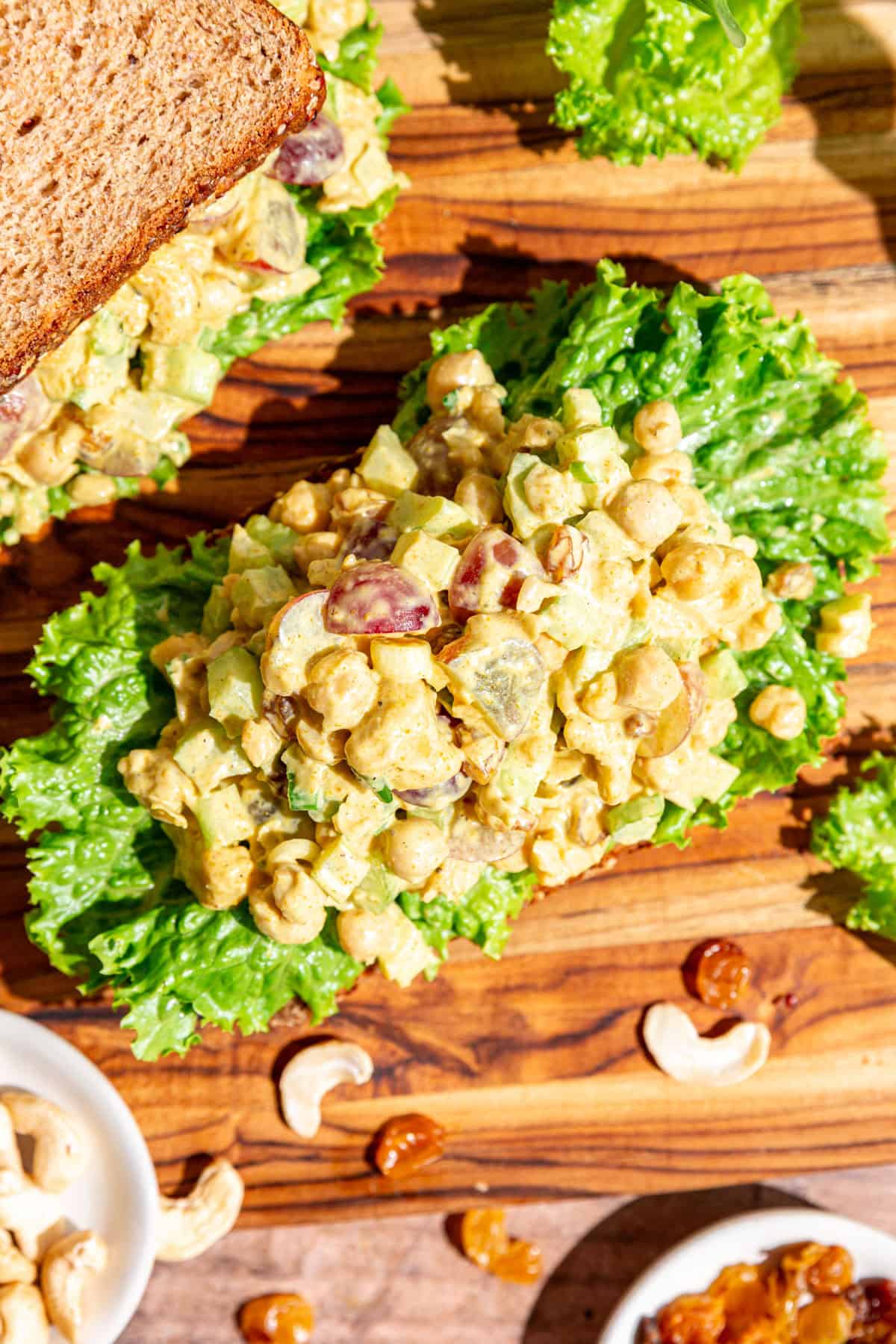 An open-faced curry chicken salad sandwich.