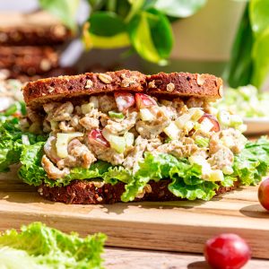 A Vegan Protein Chicken Salad sandwich with lettuce.