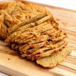 Vegan turkey deli meat sliced on a cutting board