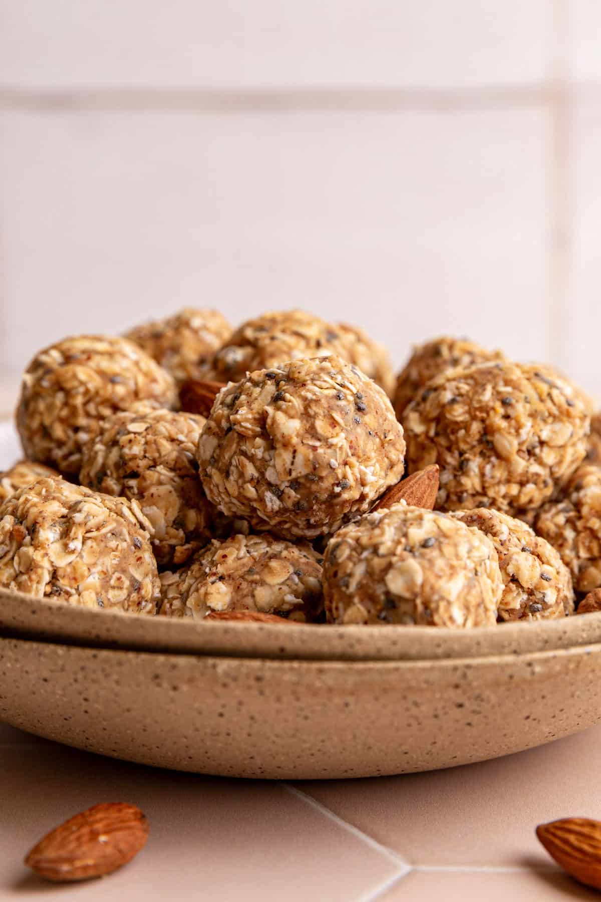 A bowl of almond butter protein balls.