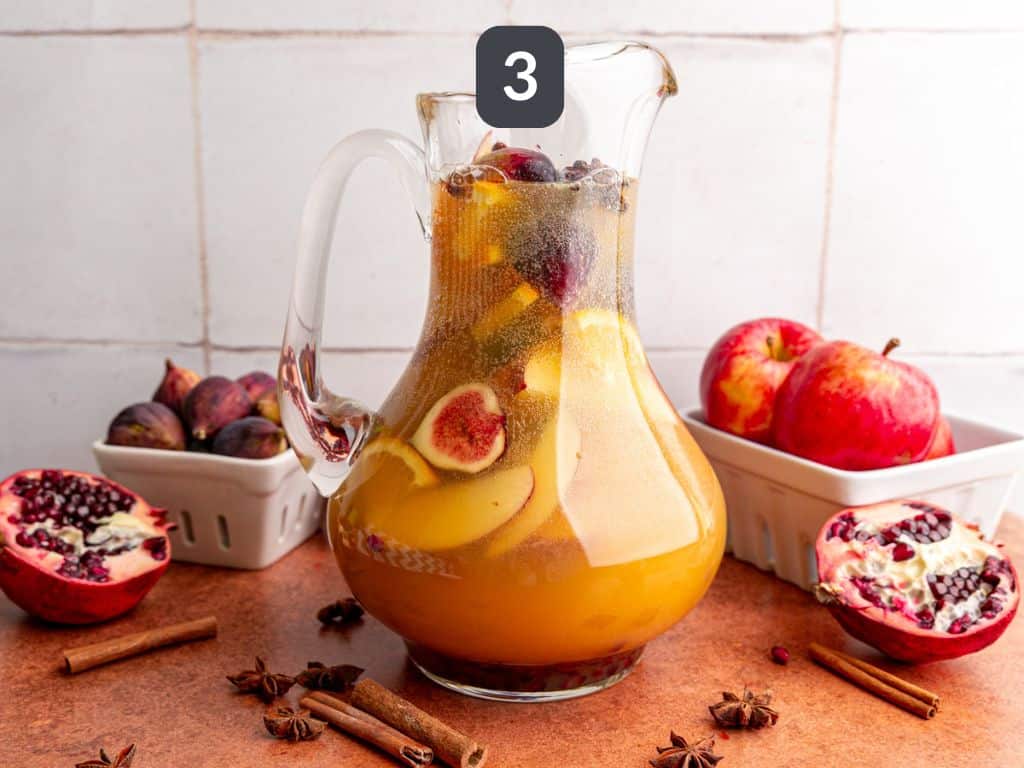 Apple cider sangria mocktail step 3 - add the seltzer water.