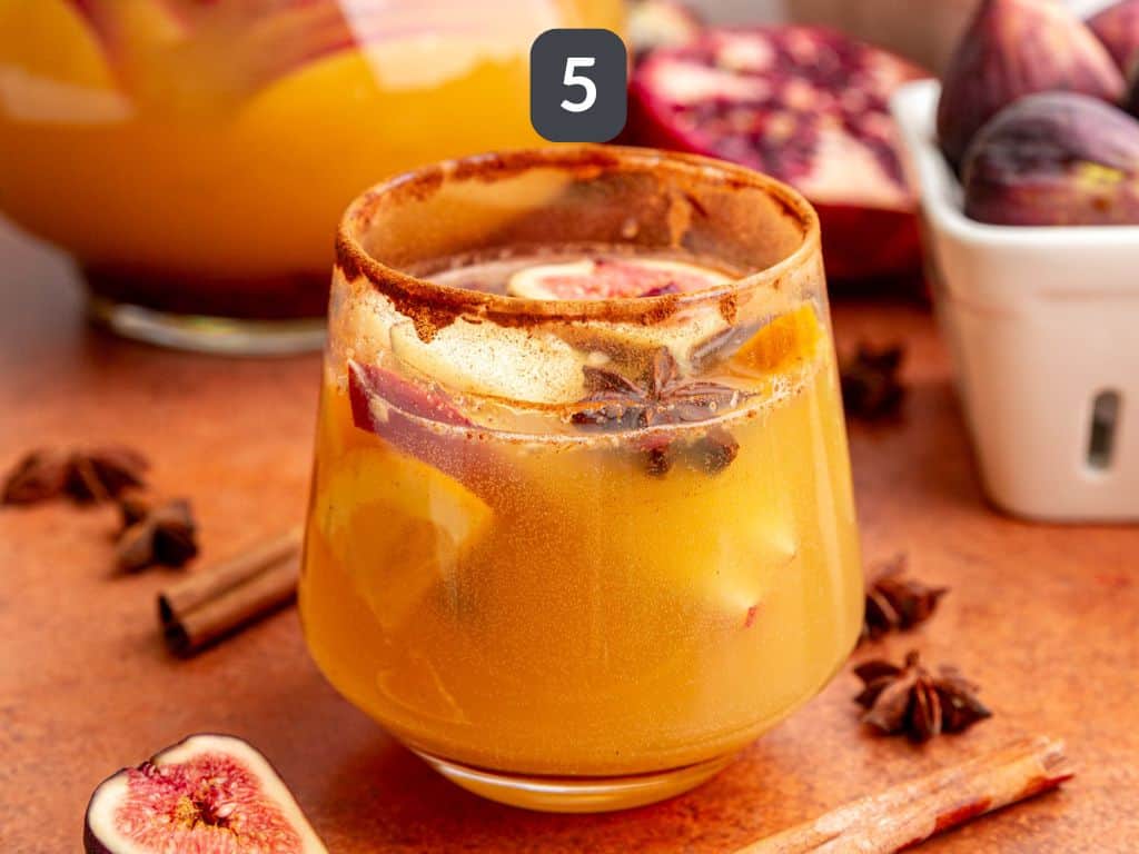 Apple cider sangria mocktail step 5 - pour into glasses and serve.