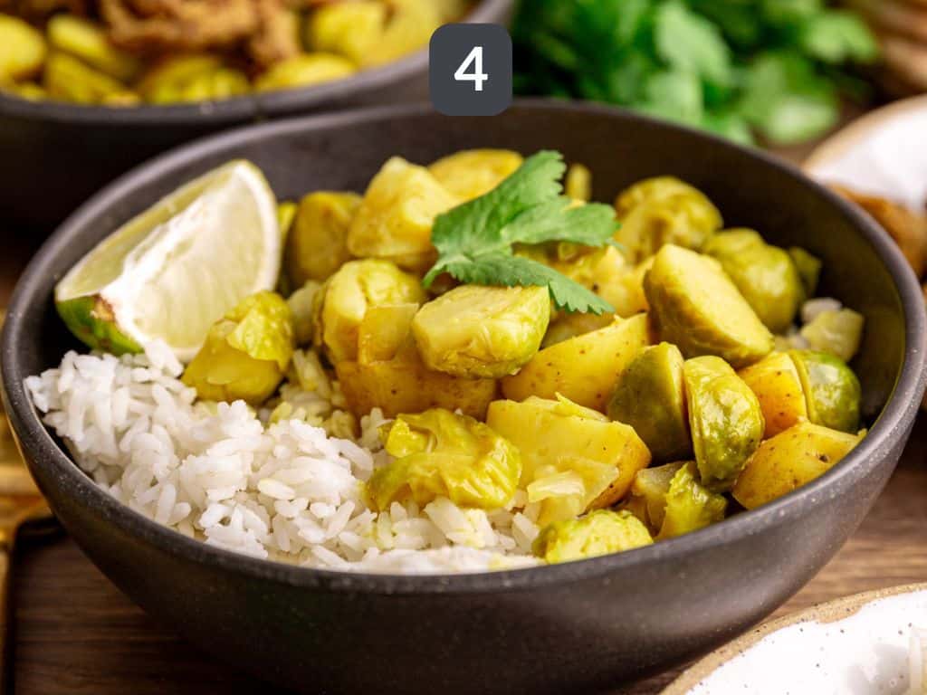 Brussels sprouts curry step 4 - serve with rice, pita, cilantro, and lime.