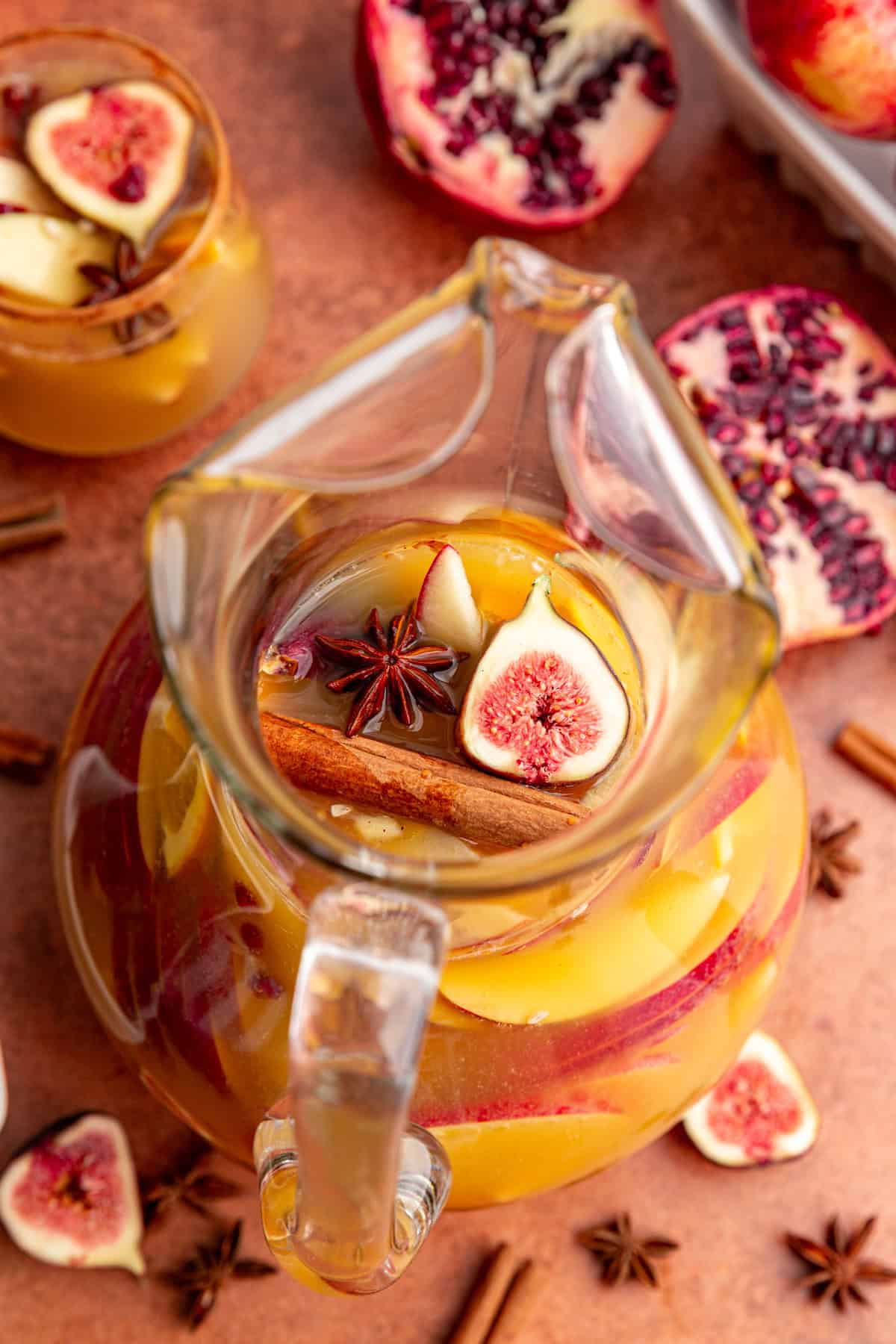 A top-down view of the fruits floating in the fall sangria mocktail