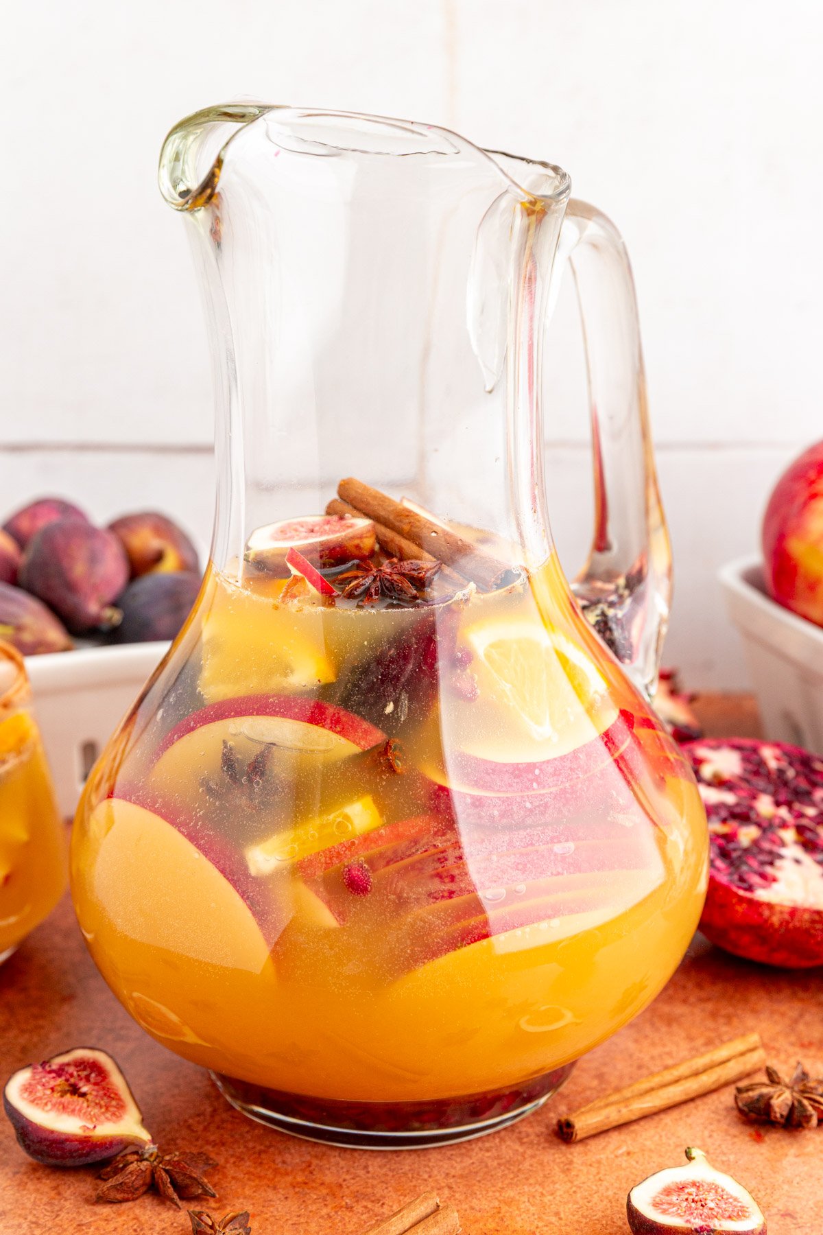 A pitcher of fall apple cider sangria mocktail