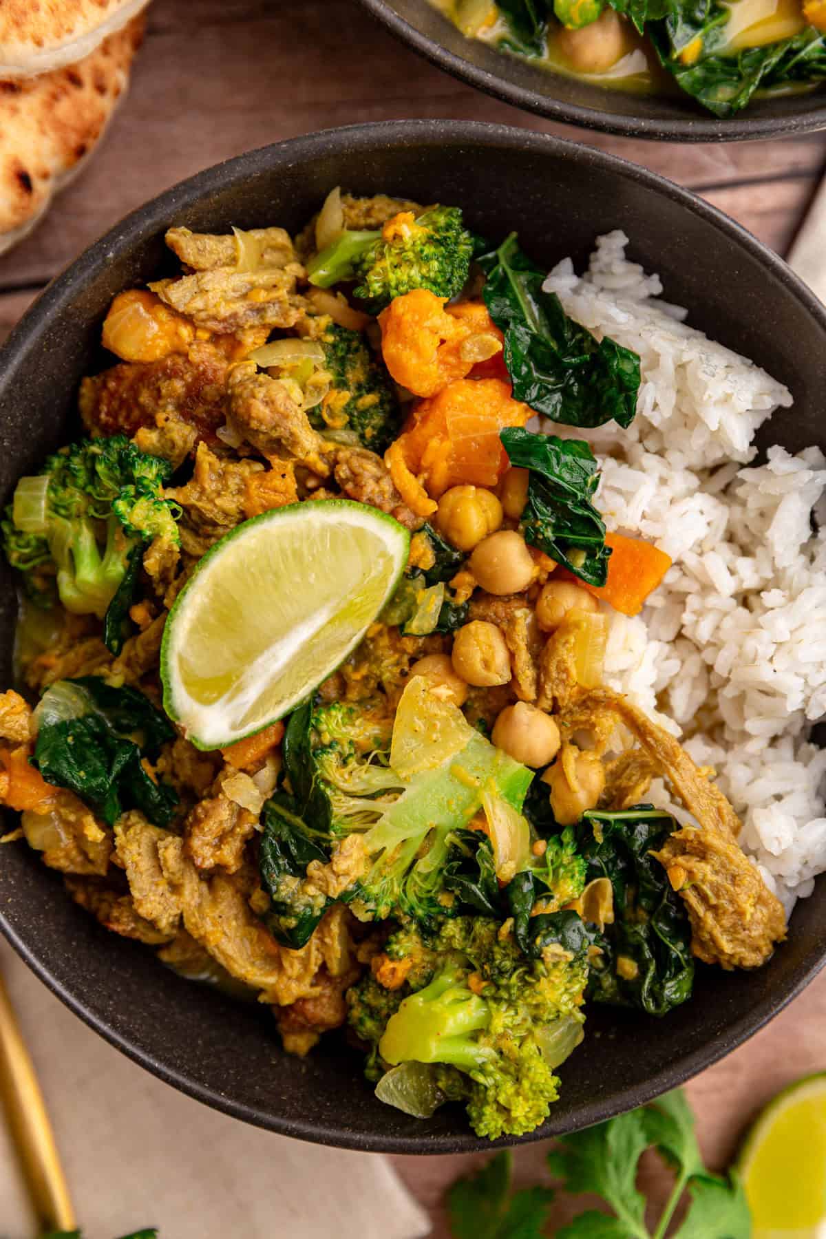 A bowl of seitan curry served over rice.