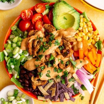 A bowl of Vegan Southwest Salad, covered in chipotle ranch.