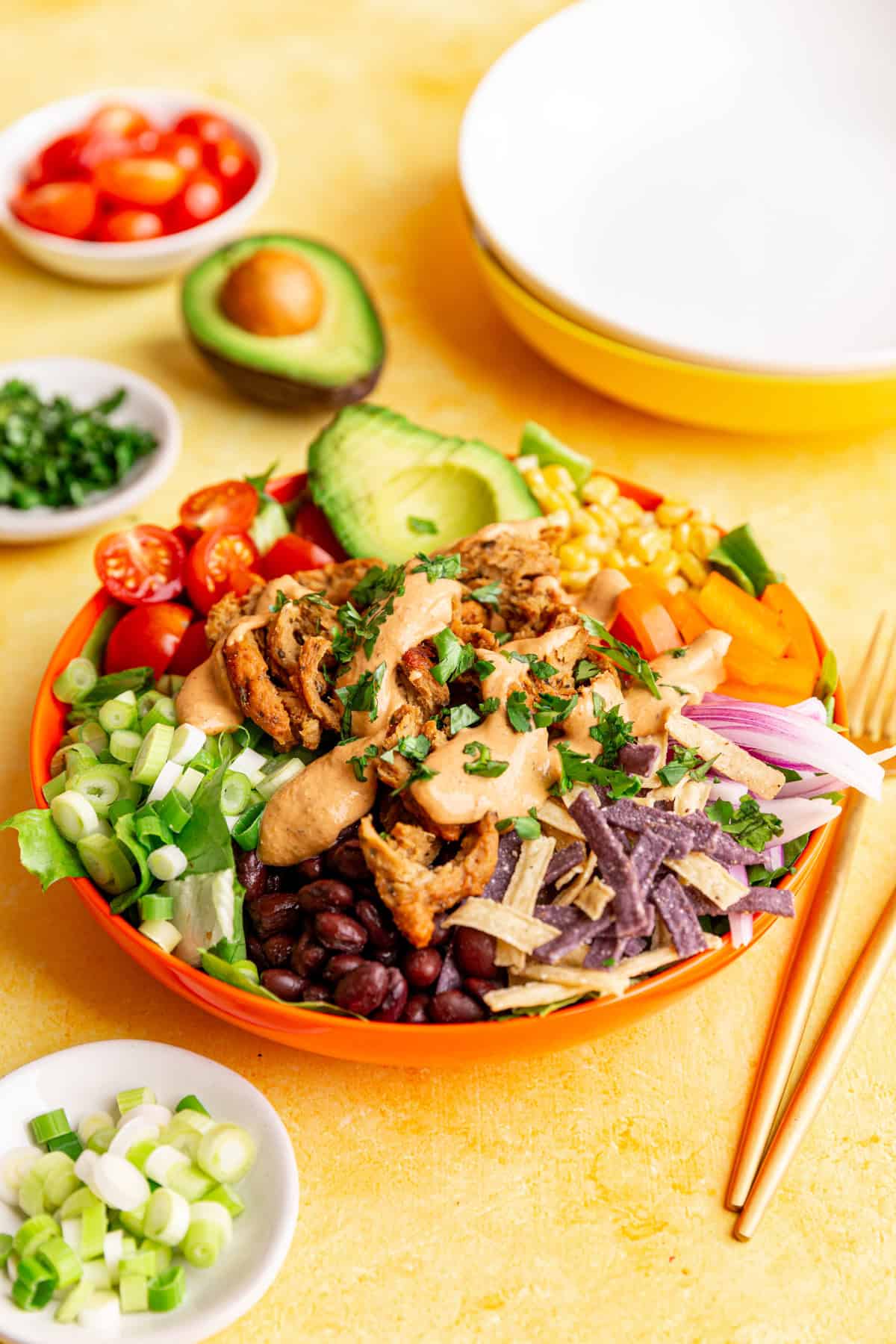 A bowl of Vegan Southwest Salad, covered in chipotle ranch.