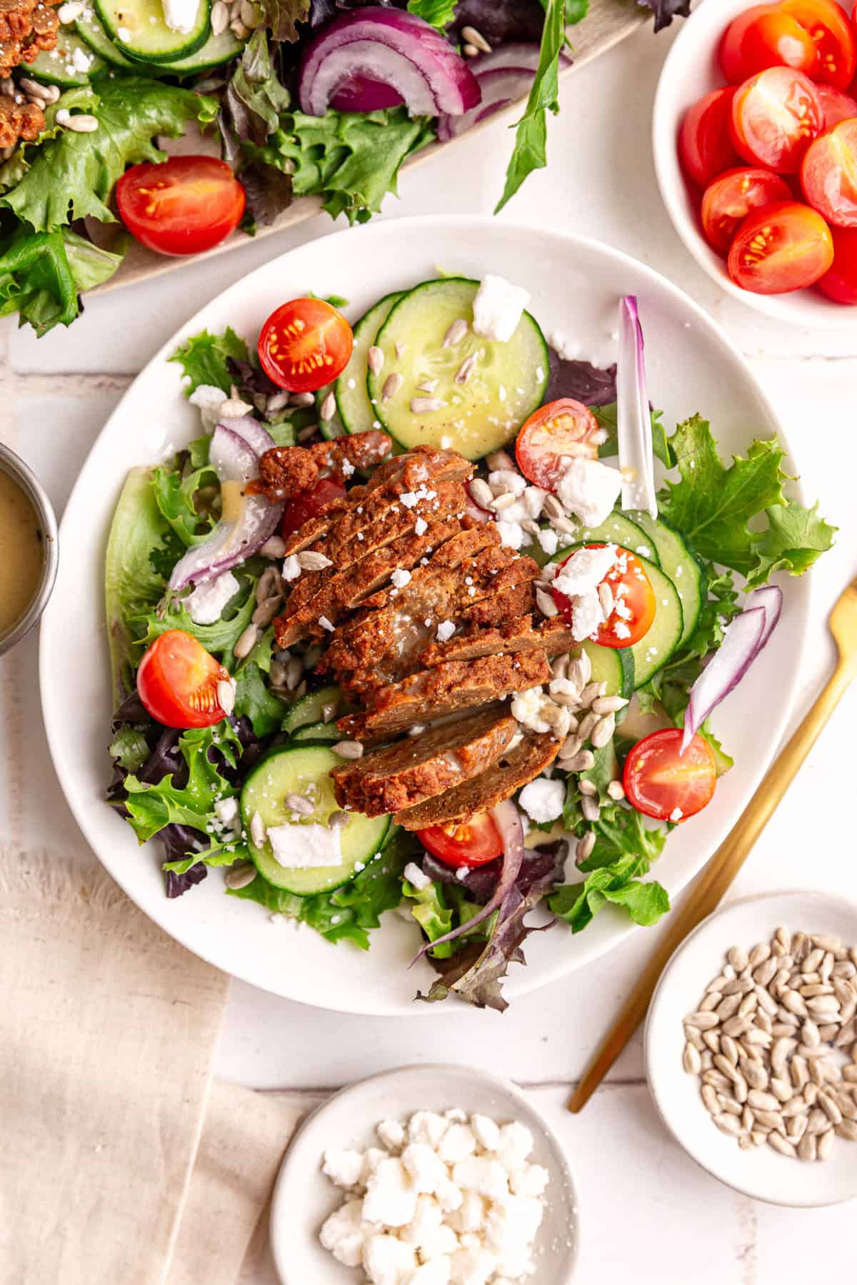 A plate of vegan steak salad, ready to eat.