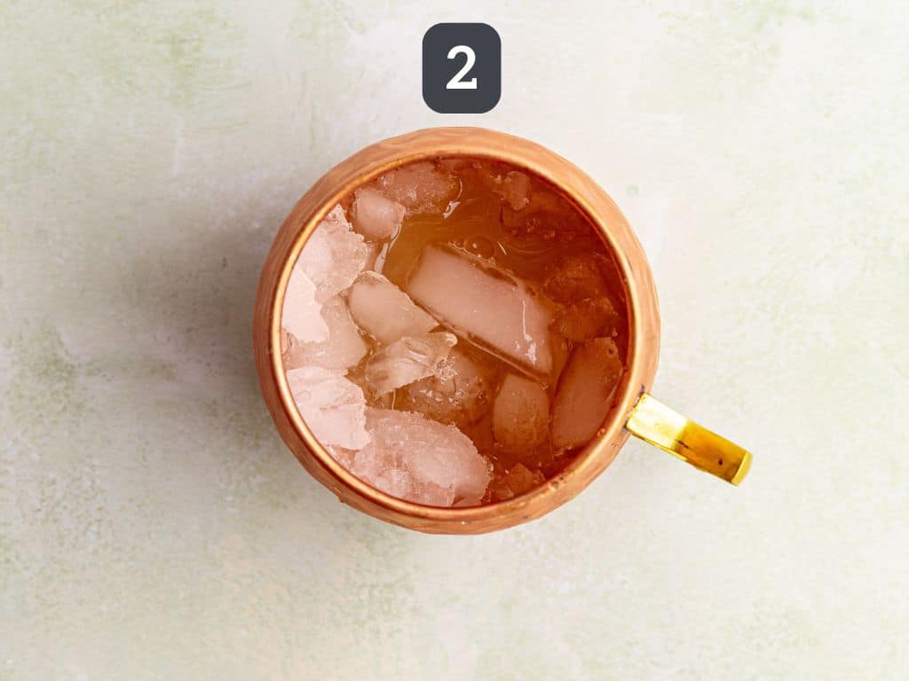 Moscow Mule Mocktail Step 2 - add the lime juice and vodka subsitute