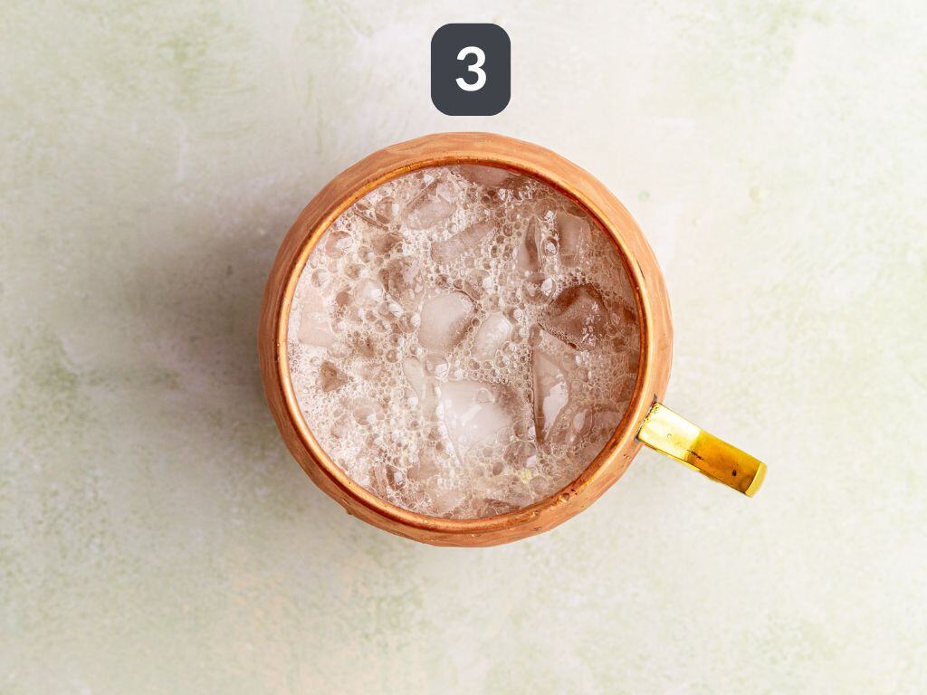 Moscow Mule Mocktail Step 3 - top with ginger beer